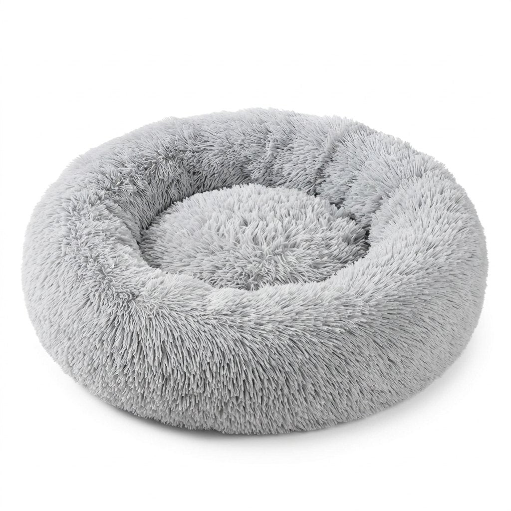 Comforting Stress Relief Pet Bed – light gray round calming donut dog bed on a white background
