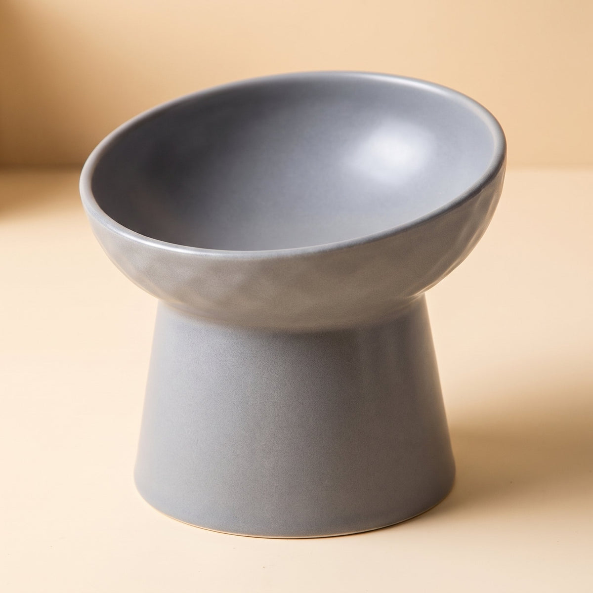 Modern Slanted Stoneware Pet Food Bowl in gray, close-up of the matte glaze and textured dish