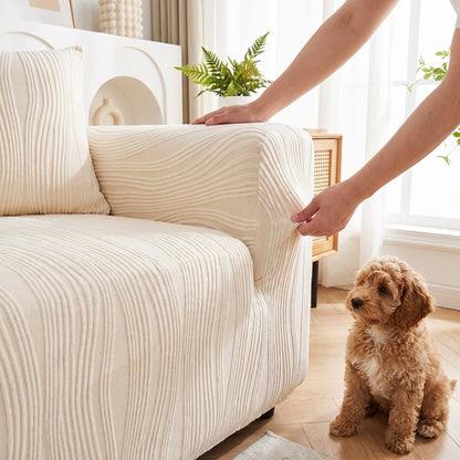 Fitting the stretch jacquard pet sofa cover over a sofa – easy to put on and take off for washing
