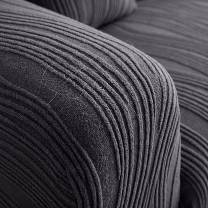 Close-up of the raised wavy-rib jacquard knit texture of the stretch pet sofa cover